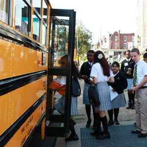 Students at Cristo Rey High School in Philadelphia board a school bus [SOURCE: Cristo Rey Network]