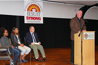 Rev. James Fleming, S.J., announces the Jesuit Strong program at Wheeling Jesuit University.