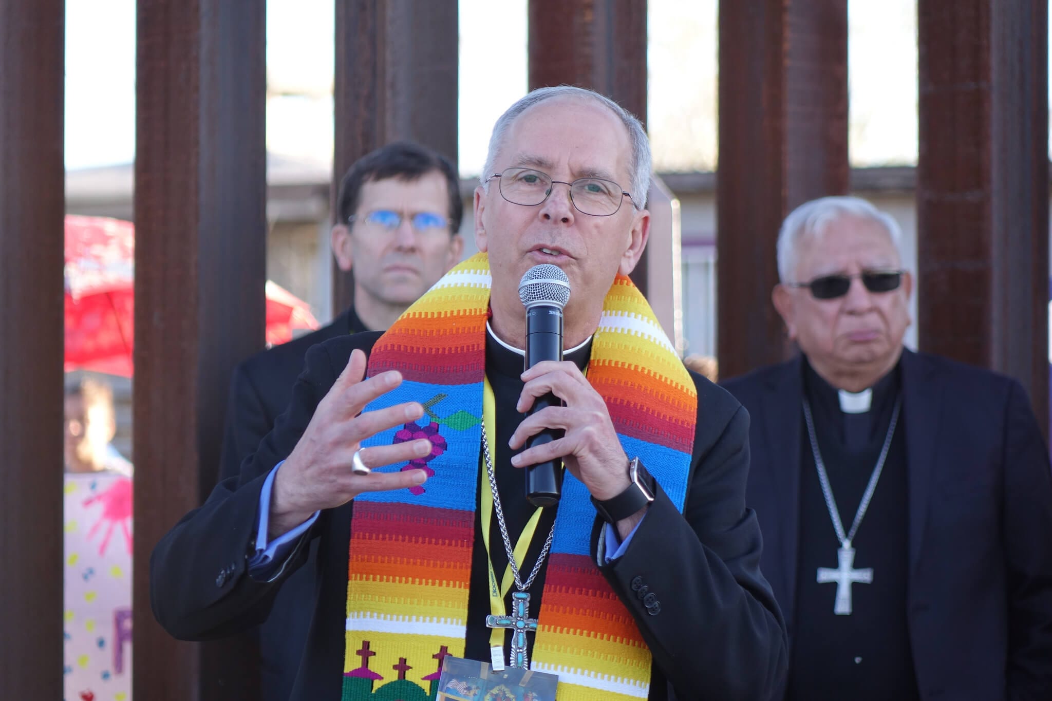 Catholic bishop Mark Seitz at the US-Mexico border wall